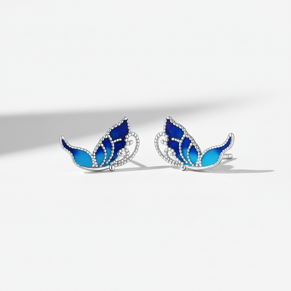 Blue enamel detailing on a 925 sterling silver butterfly wing earring, capturing a nature-inspired aesthetic