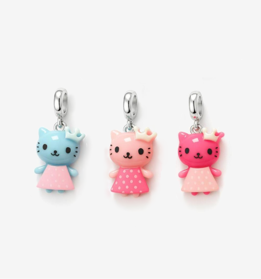 Three colorful Hello Kitty charms on a white background