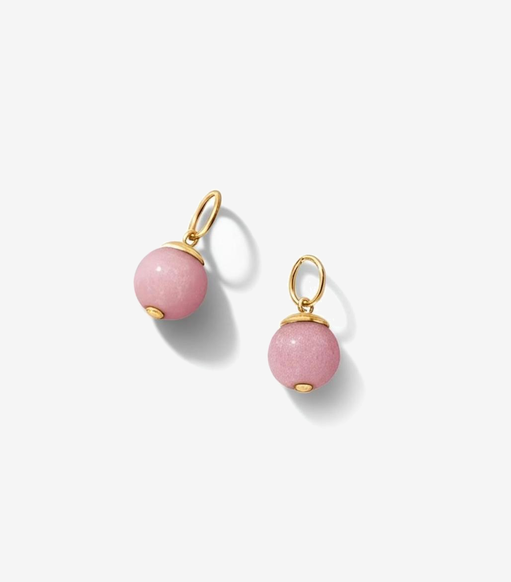 Pair of pink bead charms earrings with gold hooks on a white background