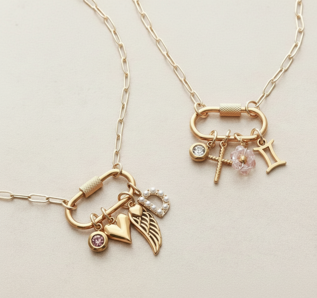 Gold-plated stainless steel necklace with various charms on a light background