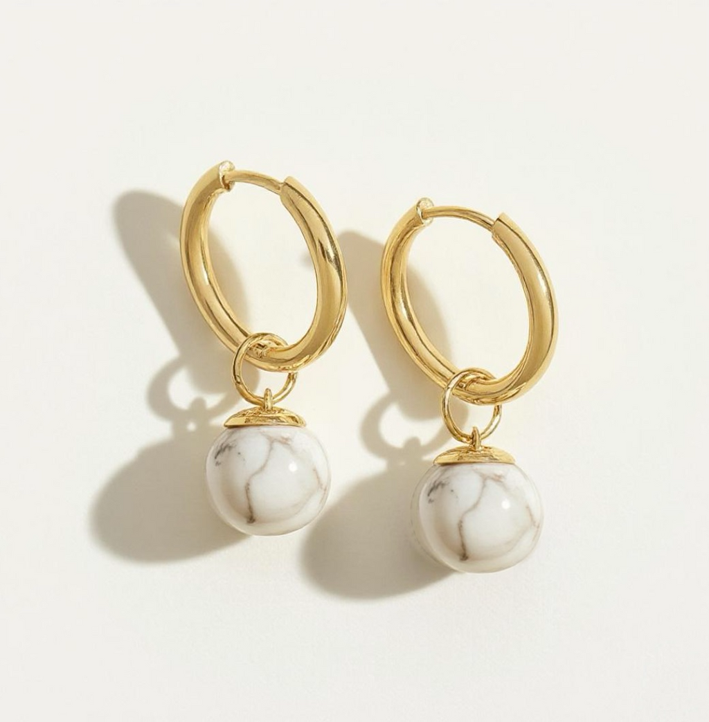 Gold hoop earrings with attached white marble beads