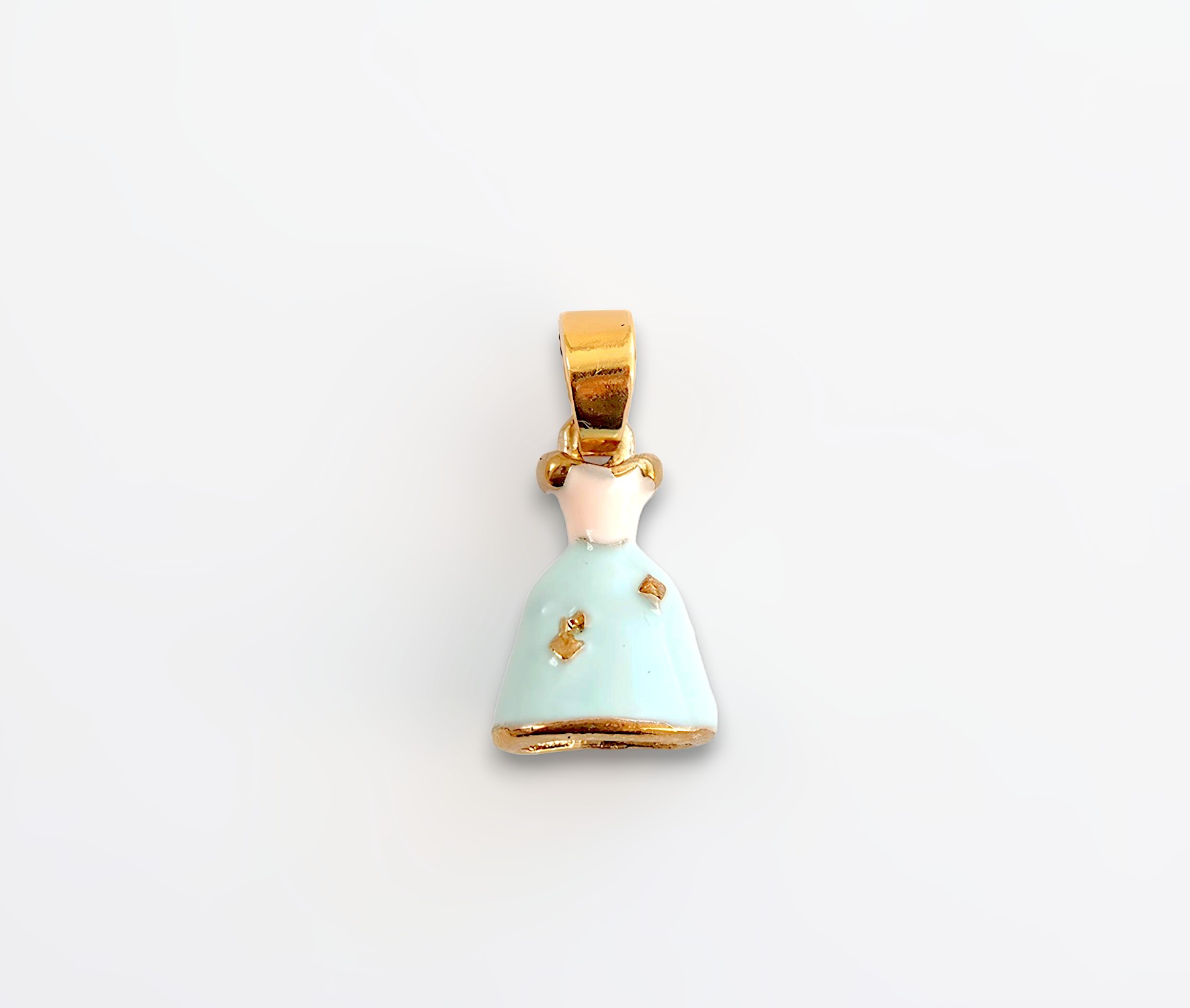 Pendant with a light green dress and gold accents