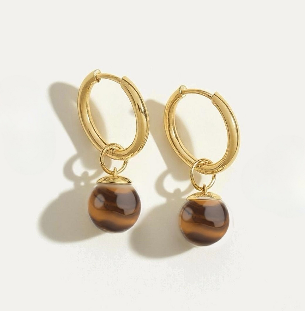 Golden hoop earrings with natural tiger eye gemstone dangle charms