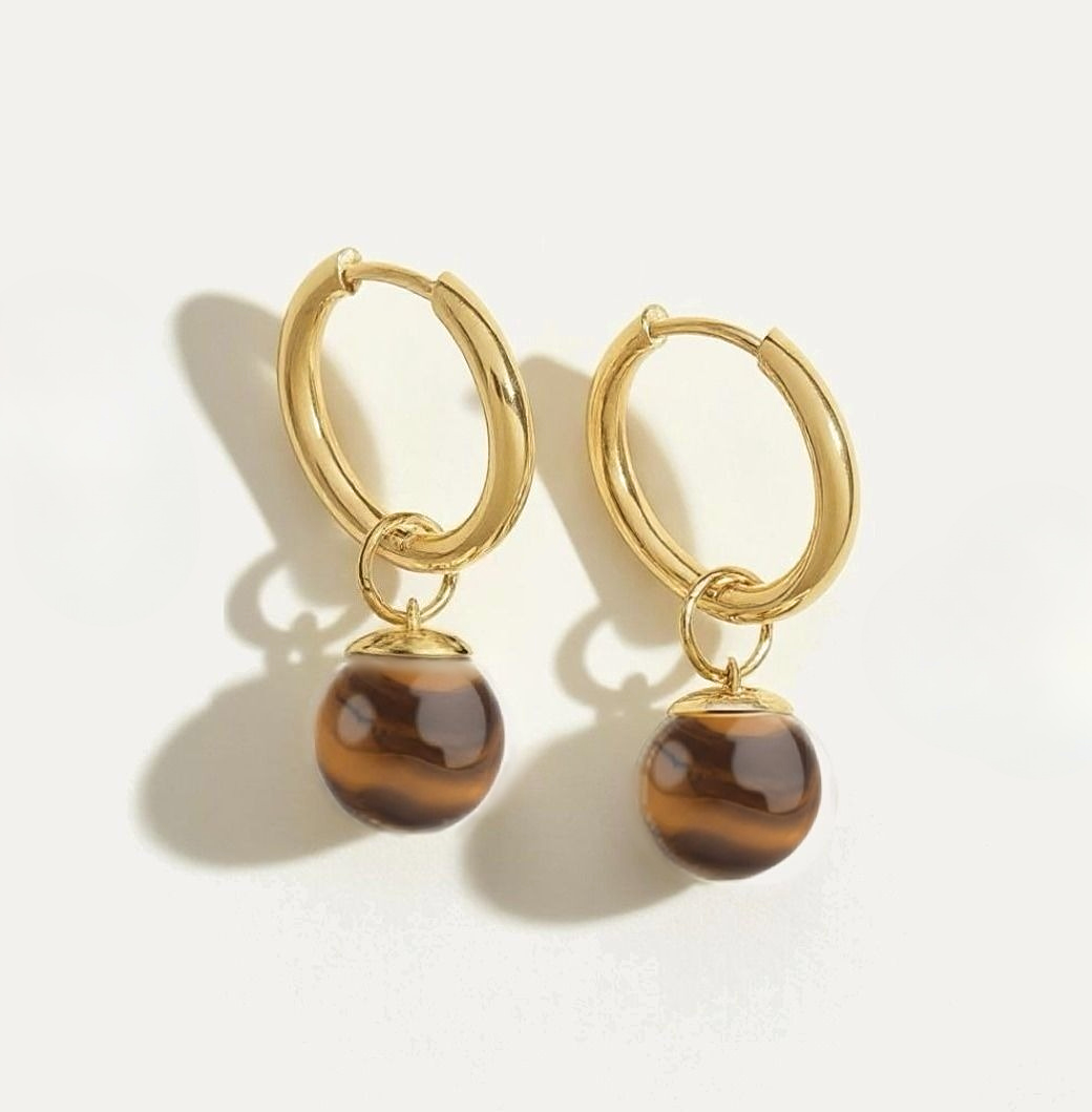 Golden hoop earrings with natural tiger eye gemstone dangle charms