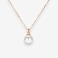 Pearl necklace with rose gold chain on a white background