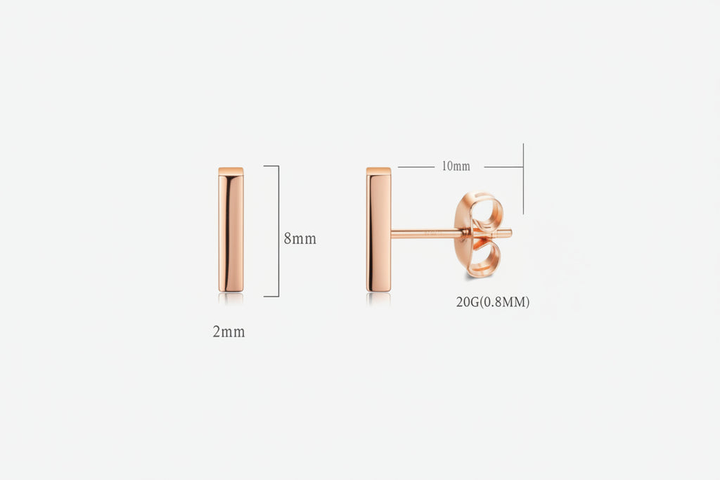 Rose gold earring on a white background