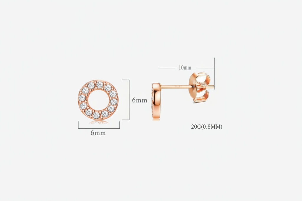Rose gold earrings with clear gemstones on a white background.