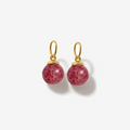 Pair of pink bead dangle charms for earrings with gold hooks on a white background