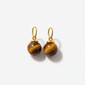 Pair of gold charms for earrings with tiger's eye stones on a white background
