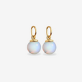 Gold earrings with round, light-colored gemstones on a white background
